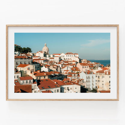 Framed photo Miradouro of a coastal European city with red rooftops, white buildings, and a large dome.