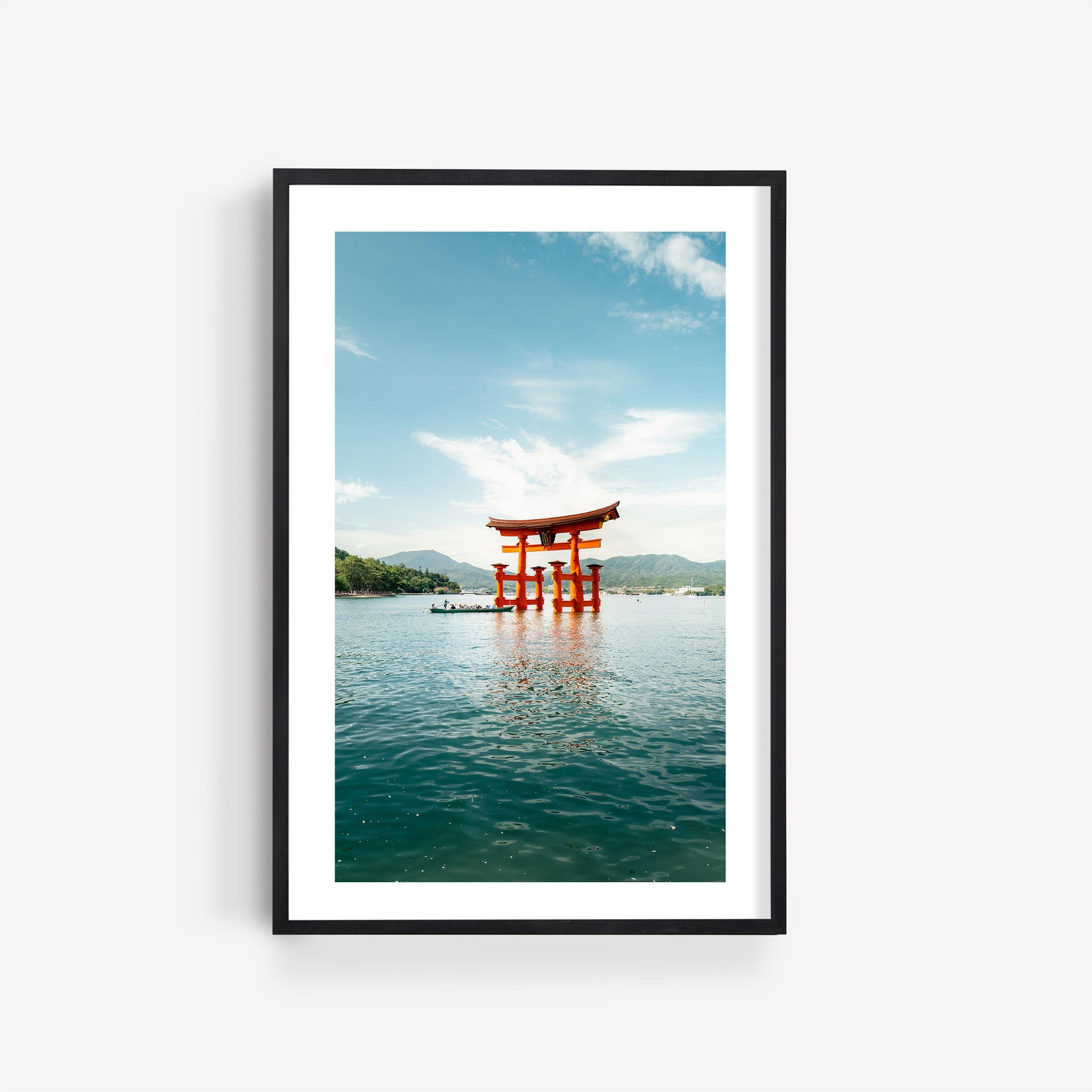 Framed photo named Miyajima Passage II shows a red torii gate in water under a sky with clouds.