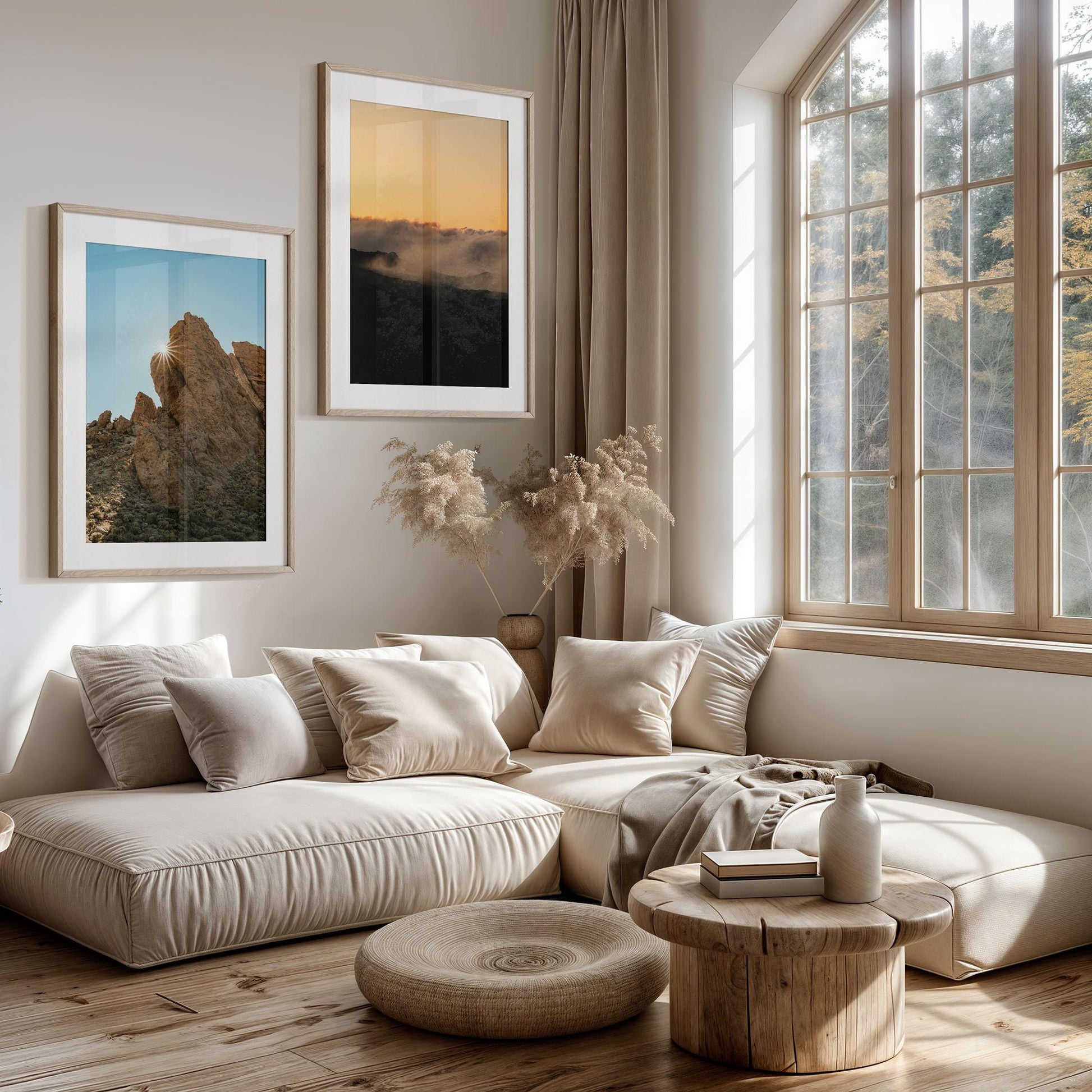 Modern living room with beige sofa, round wooden tables, large window, and Mount Teide Reverie - Set of 2 on the wall.