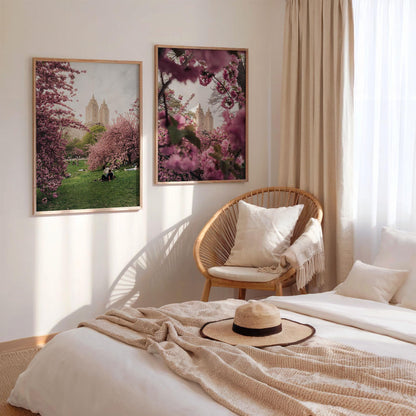 Cozy bedroom with beige bedding, a straw hat, wicker chair, and NYC Cherry Blossoms - Set of 2 on the wall.