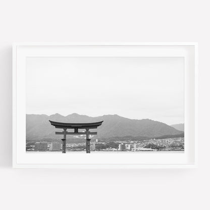 A framed photo titled O-Torii Gate - Black and White features a torii gate with mountains and a cityscape in the background.