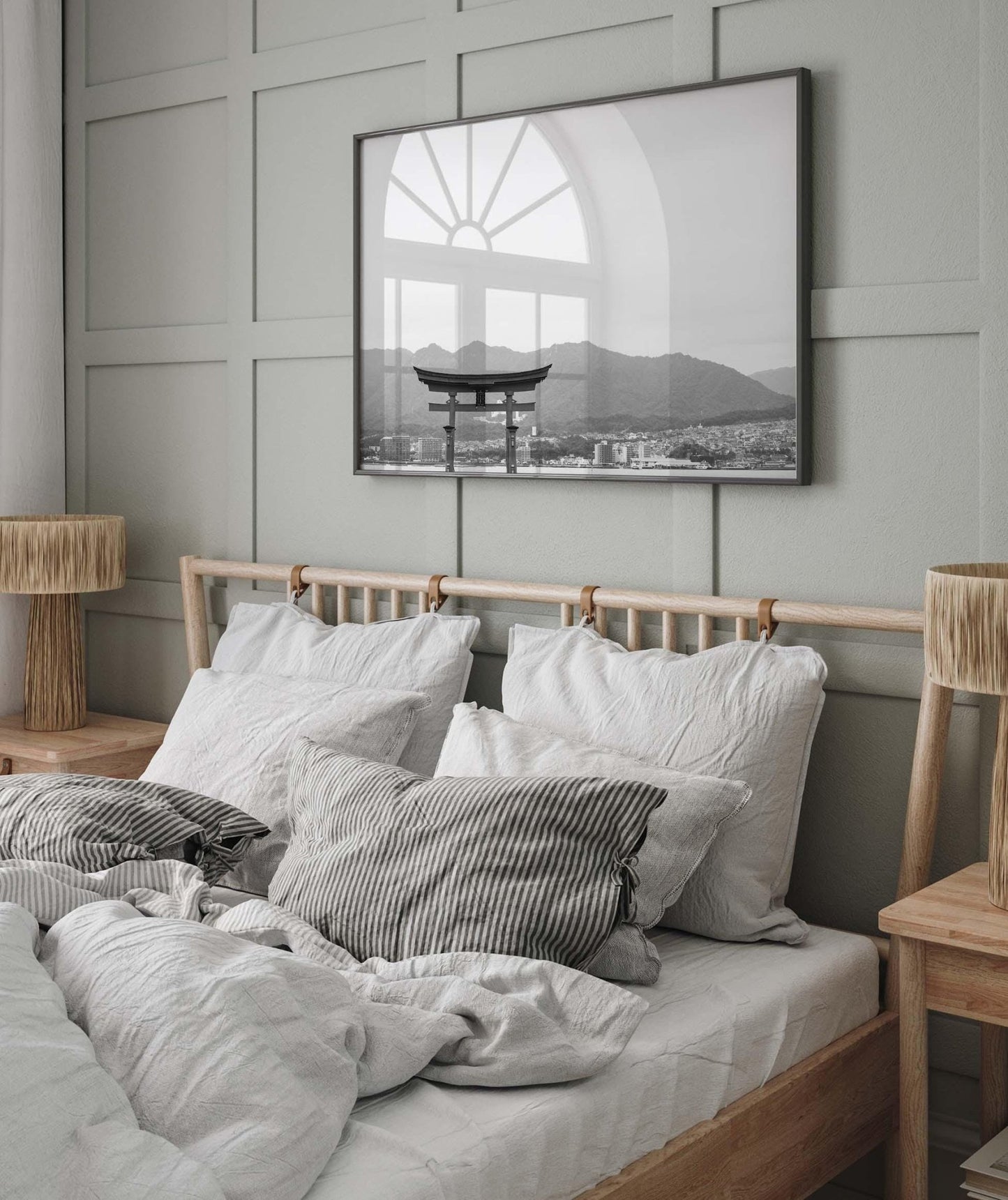 Cozy bedroom with gray panel wall, neutral bedding, and the O-Torii Gate - Black and White framed picture above the wooden headboard.