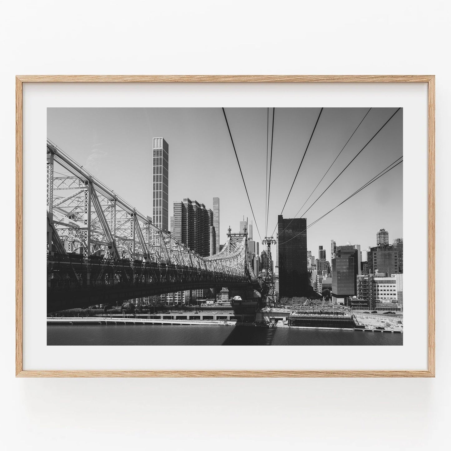 Black-and-white photo of the Queensboro Bridge and city skyline.