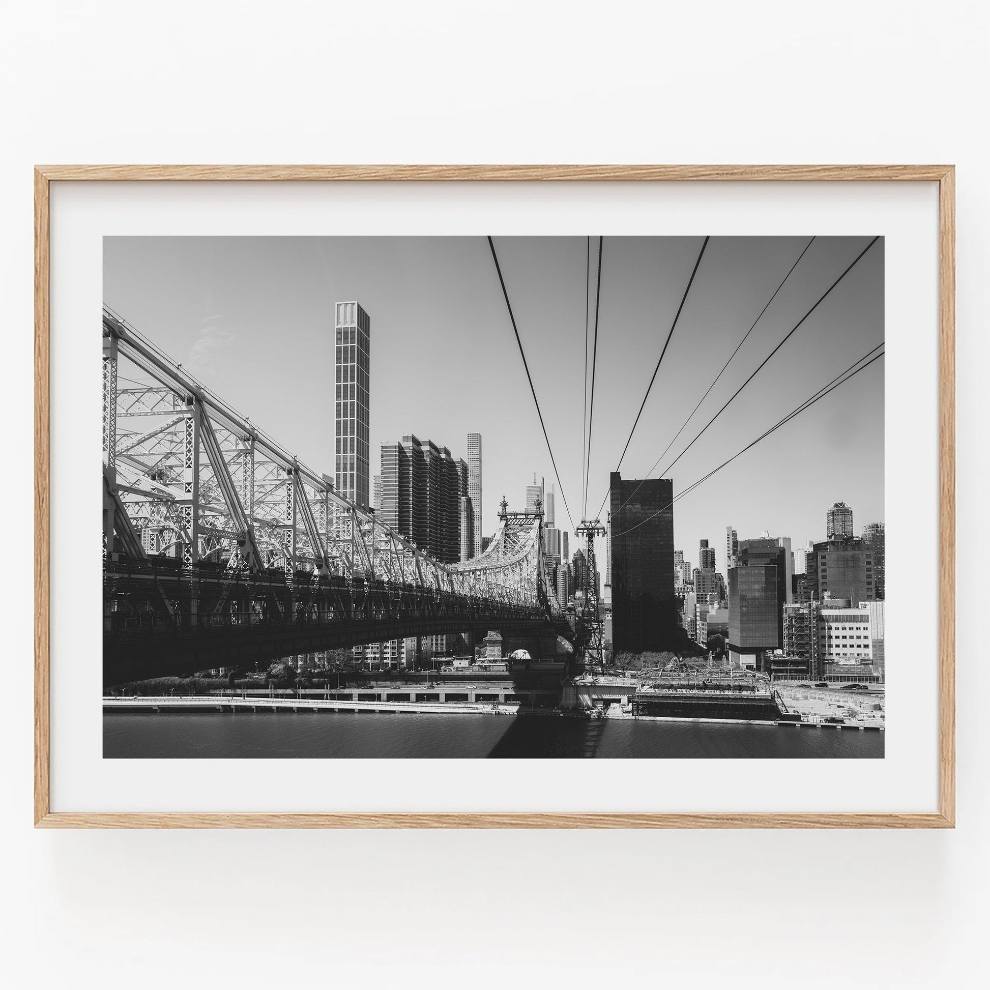 Black-and-white photo of the Queensboro Bridge and city skyline.