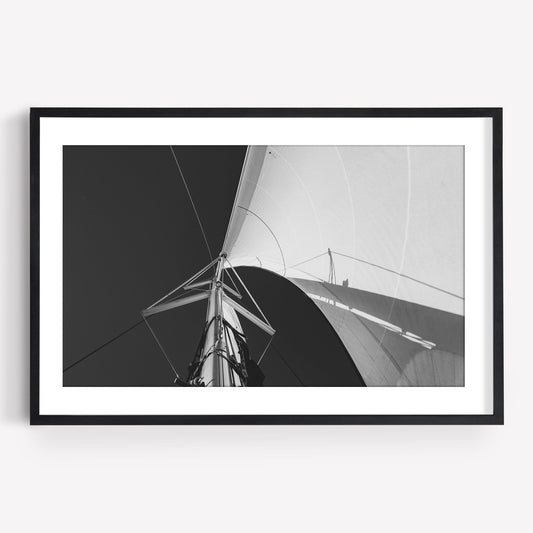 Sailing Bliss Black and White: A striking photo of a sailboat mast and sail from below, showcasing clear geometric lines.