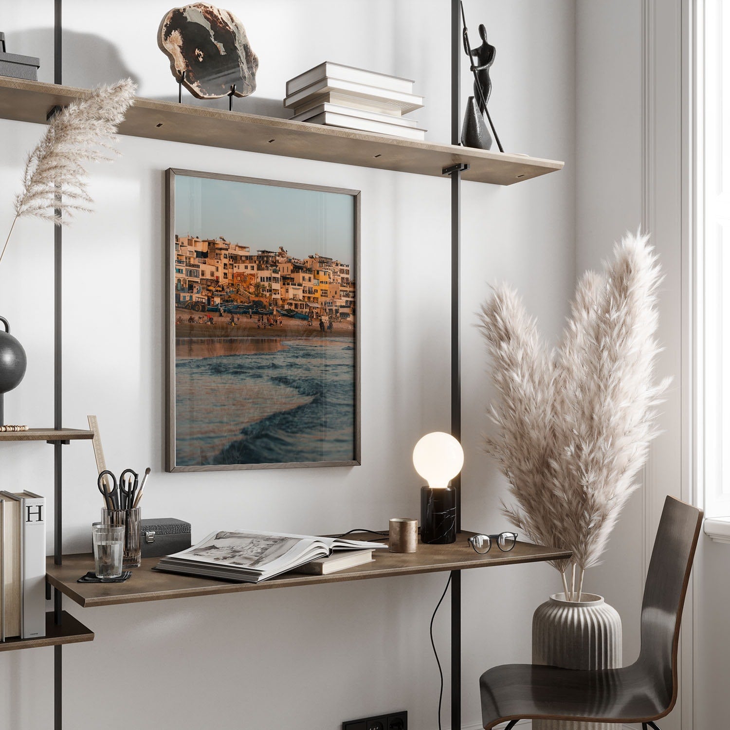 Minimalist workspace with a wooden desk, decorative plants, a soft-lit lamp, and the Taghazout Wave photo on the wall.