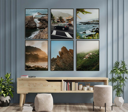 The Tenerife - Set of 6 framed photos decorates a blue wall above a wooden desk with books, decor, and a stool.
