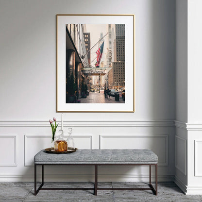 The Westin cityscape photo above a bench with a pitcher, glasses, and tray of flowers in a minimalist room.