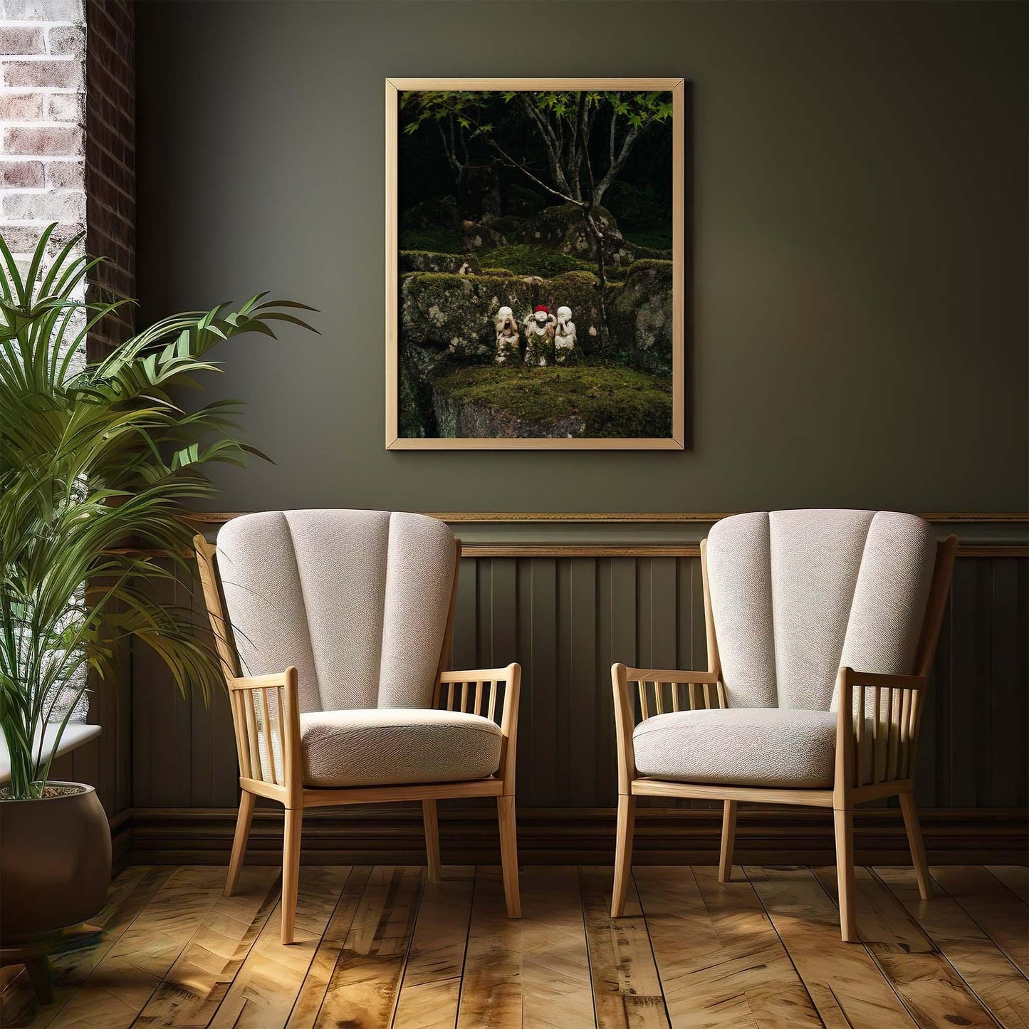 A room with two beige chairs, a framed Three Wise Ones nature photo, and a potted plant on a wood floor.