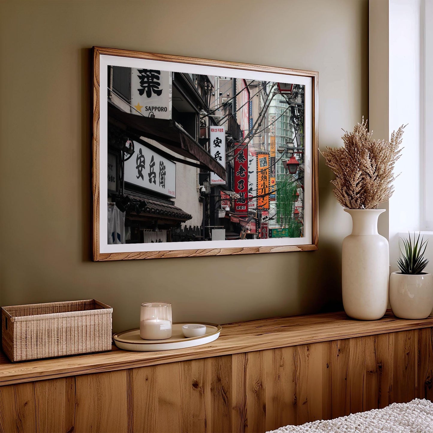 Urban Tapestry cityscape photo with Japanese signs displayed on a wall above a decor-adorned wooden shelf.