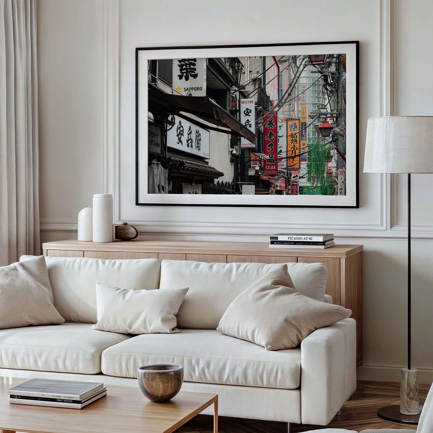 Modern living room featuring Urban Tapestry, a framed photo showcasing an Asian street scene with various signs and buildings.