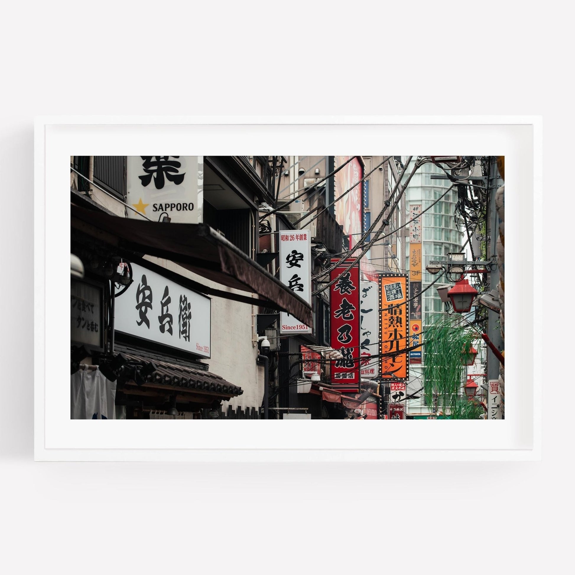 Urban Tapestry captures a street scene with Japanese shop signs and hanging cables in an urban area.