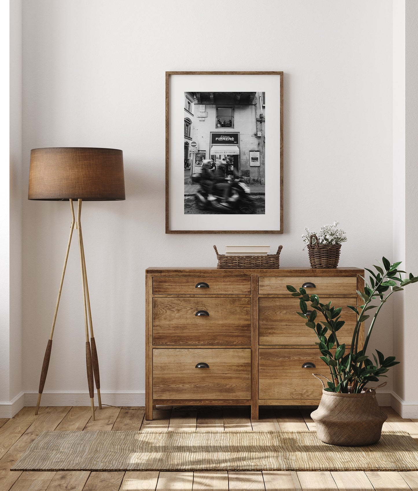 Black and white photography of a motorcycle blurred with speed in Florence, Italy against a wood home decor.