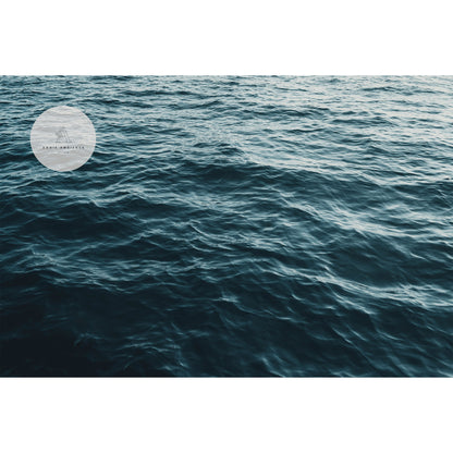 Teal blue ocean water ripples close up.